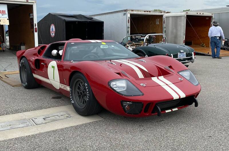 Red First Generation Mustang on track at Daytona